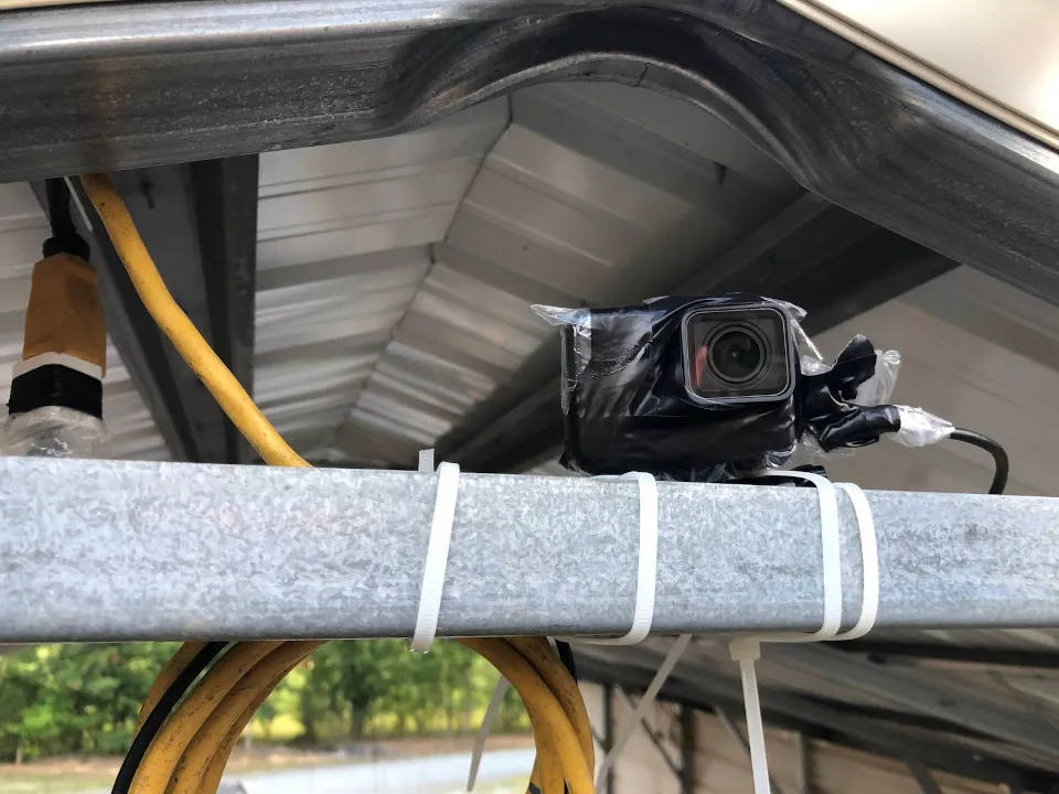 My GoPro mounted on an outdoor roof beam, powered, wrapped in plastic and electrical
tape.